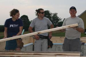 volunteers_with_plank volunteers_with_plank
